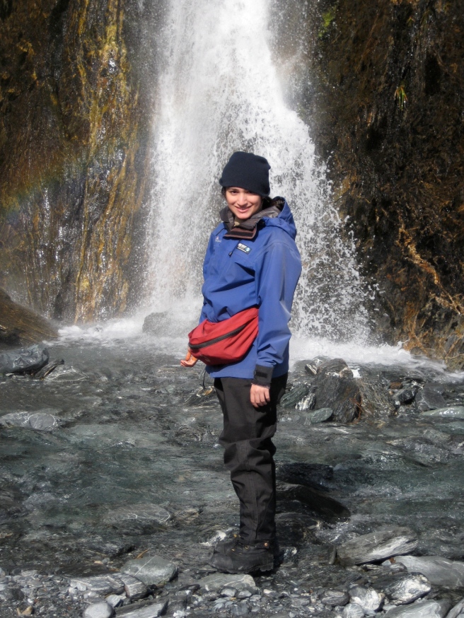 Posing in front of a waterfall en route to the glacier