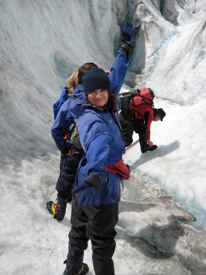 climbing up the glacier and posing for a photo